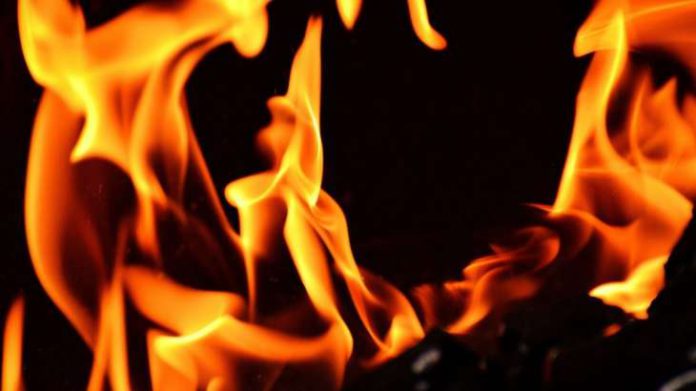 Man sets copassenger on fire